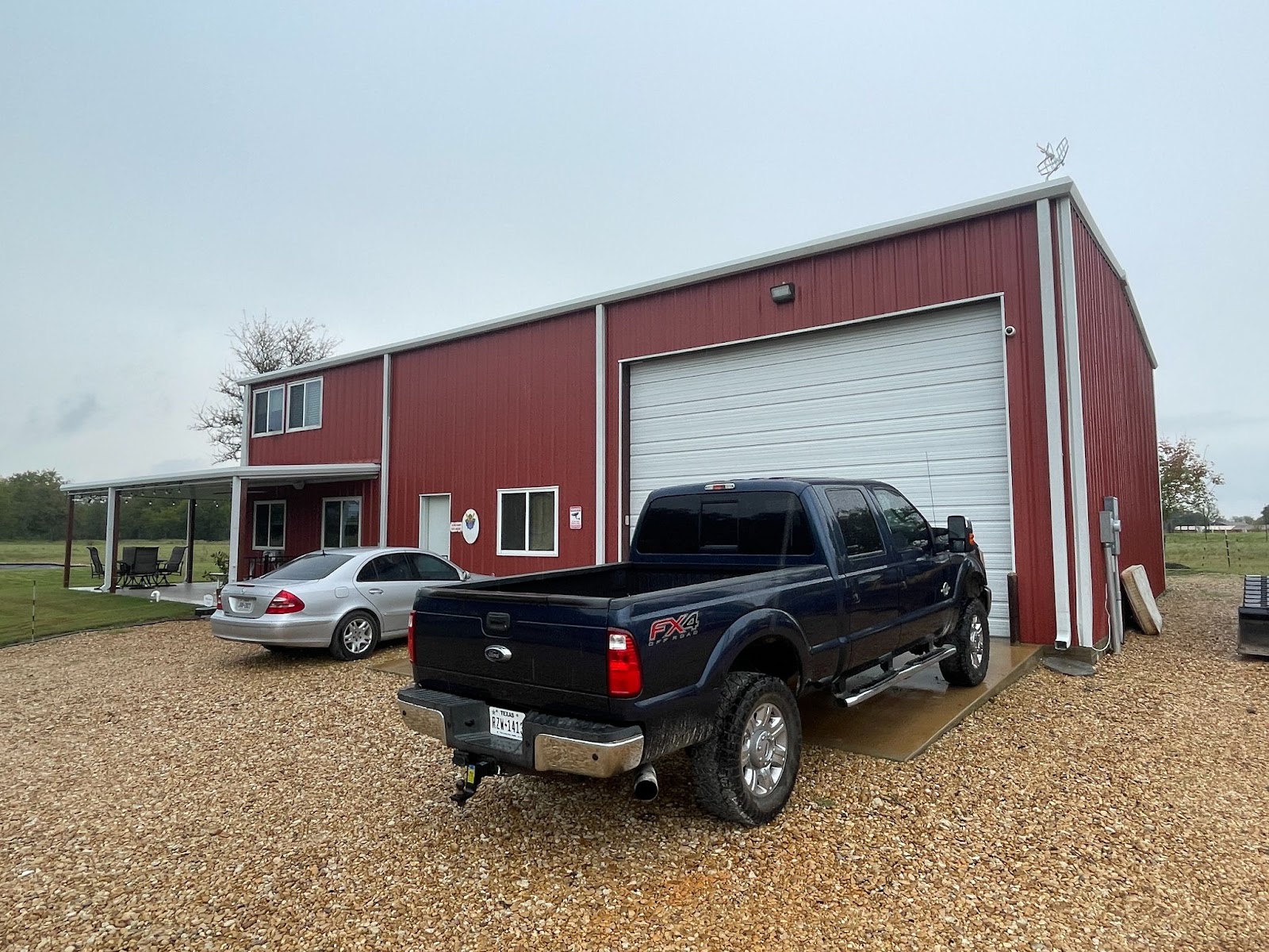 Large single-door garage of the Bryan-College Station Barndominium by Bryan and Sonja