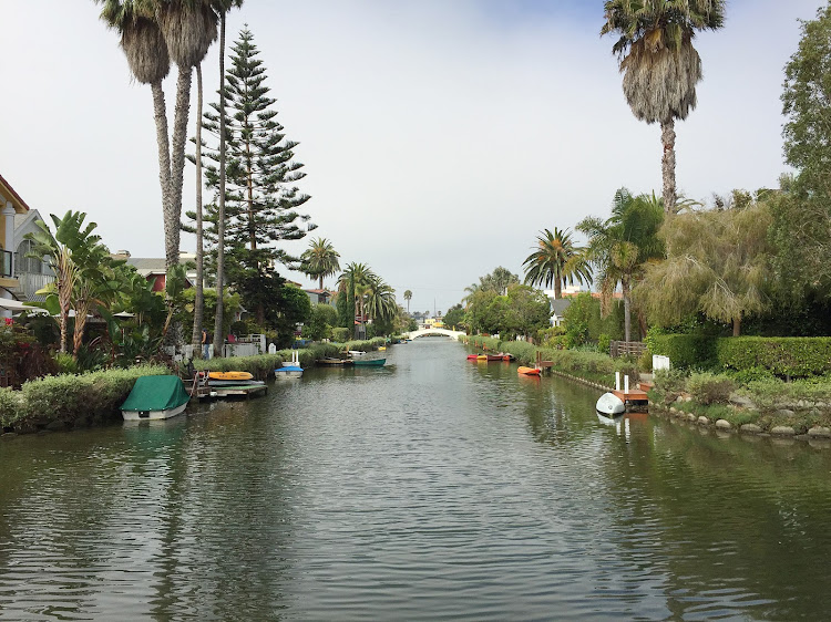 A view from a footbridge spanning one of the canals of Venice, California. 