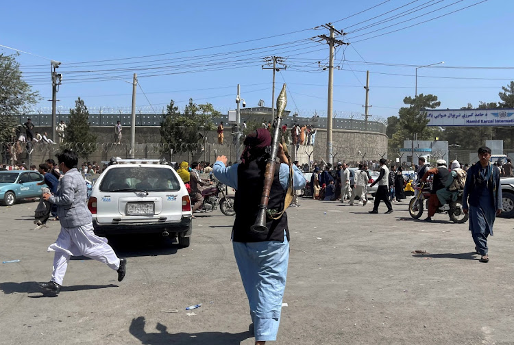 A member of Taliban forces inspects the area outside Hamid Karzai International Airport in Kabul, Afghanistan, on August 16 2021. Picture: REUTERS/STRINGER