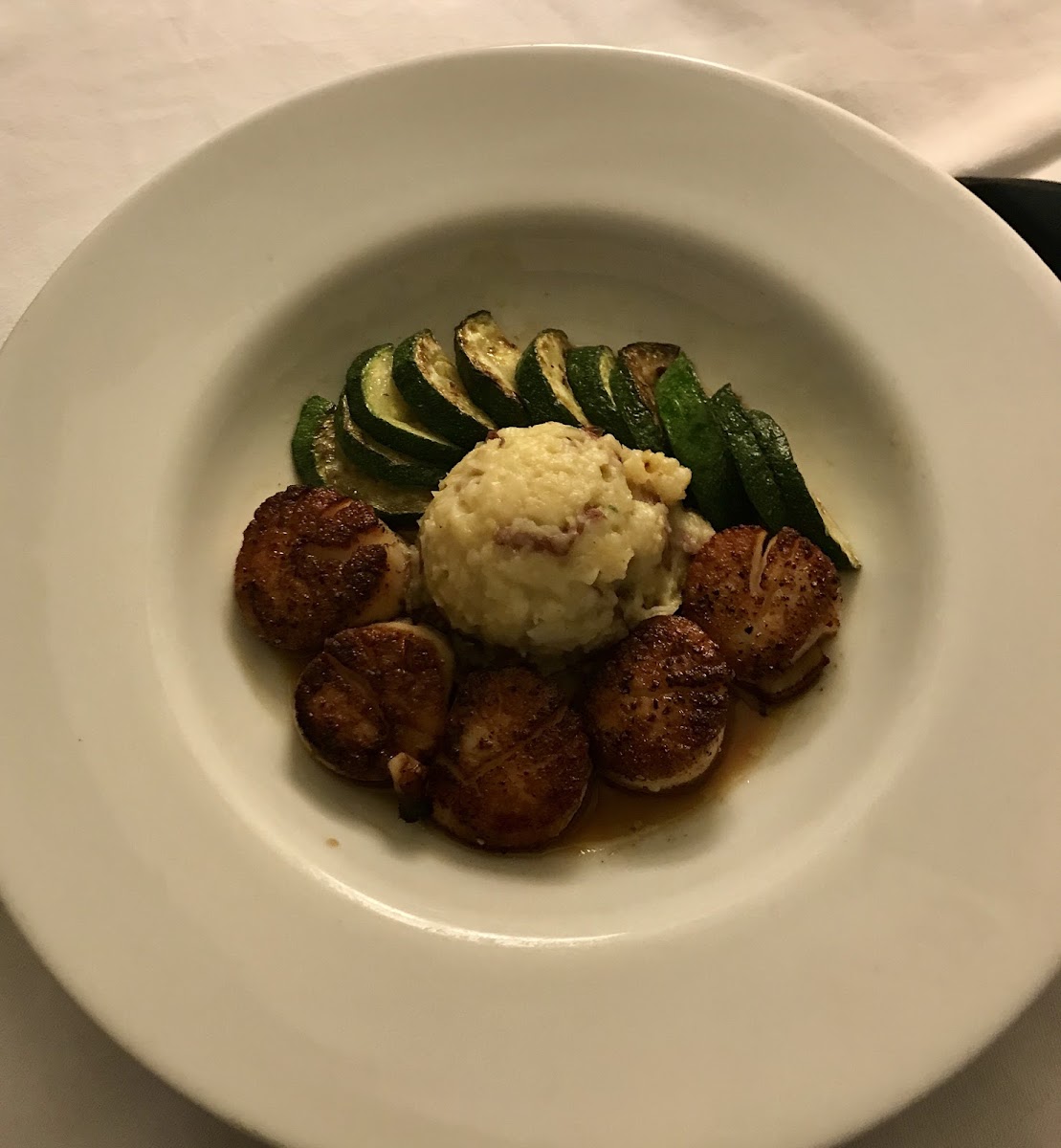 Scallops with mashed potatoes & zucchini.