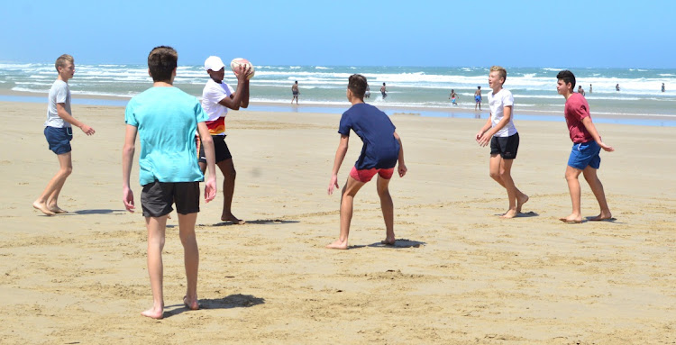 Although there were some tragic incidents on the beaches,the holiday spirit couldn't keep many away from enjoying the sea and sun at Nahoon Beach on Monday .