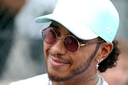 Lewis Hamilton of Great Britain and Mercedes GP smiles in the Paddock during previews ahead of the F1 Grand Prix of Belgium at Circuit de Spa-Francorchamps on August 29, 2019 in Spa, Belgium.