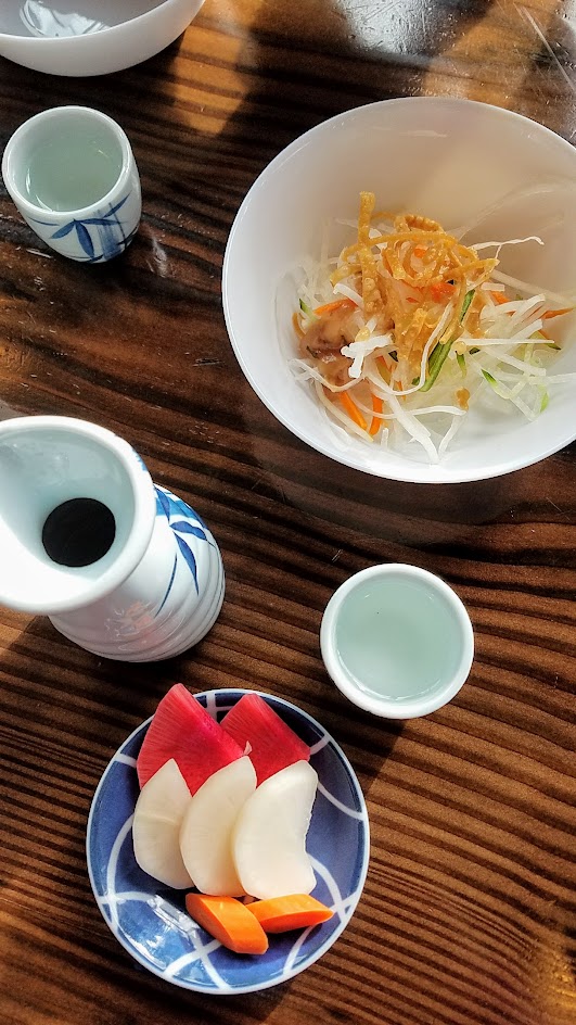 Marukin Ramen side (also available at happy hour) of light shredded daikon salad with ume plum vinaigrette and nukazuke, or Japanese pickled vegetables