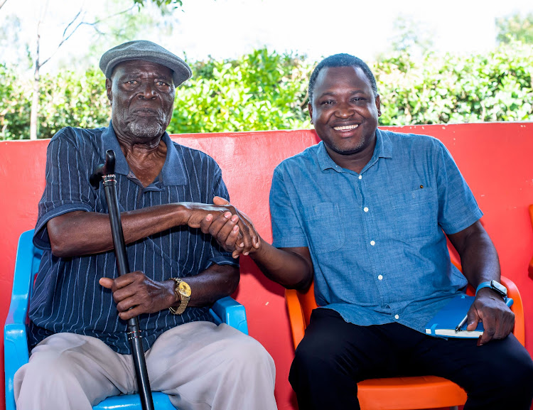 Shofco CEO and Founder Dr. Kennedy Odede with the Luo Council of Elders Chairman Ker Odungi Randa at his home in Nyando, Kisumu County.