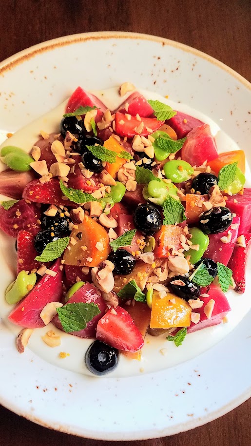 Quaintrelle dish of Beets, blueberry, strawberies, chevre, favas, hazelnuts, and mint 