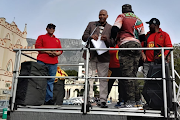 Gcina Matakane, the procedural adviser in the office of the speaker, received Cosatu's memorandum outside parliament. 