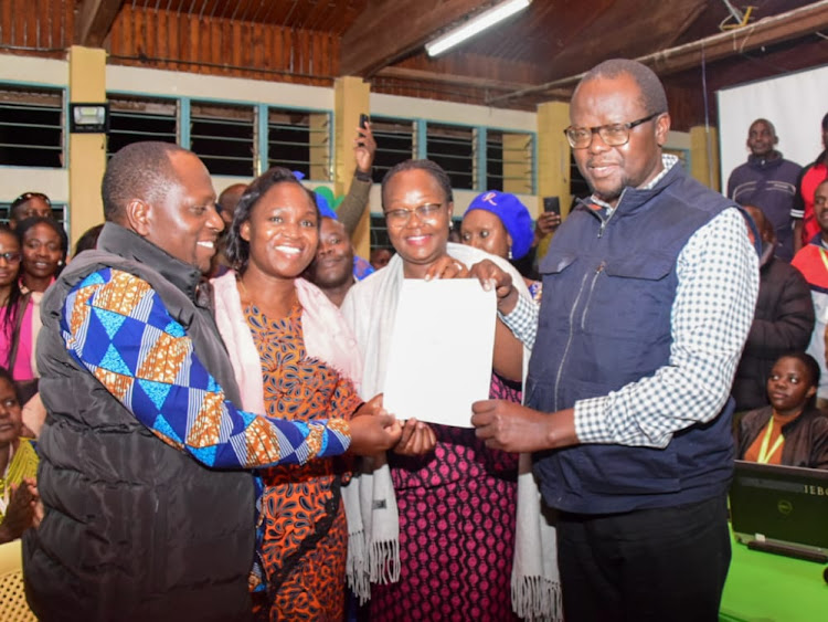 Deputy Governor Gimunta Mahiri and Ochillo Ayacko hold the nomination certificates as their spouses look on