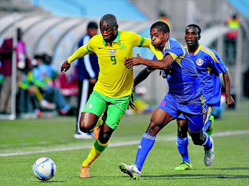 LIVEWIRE: Bafana Bafana midfielder Judas Moseamedi evades Njabulo Ndlovu of Swaziland during their Cosafa Cup semifinal in Windhoek last night PHOTO: Muzi Ntombela/BackpagePix