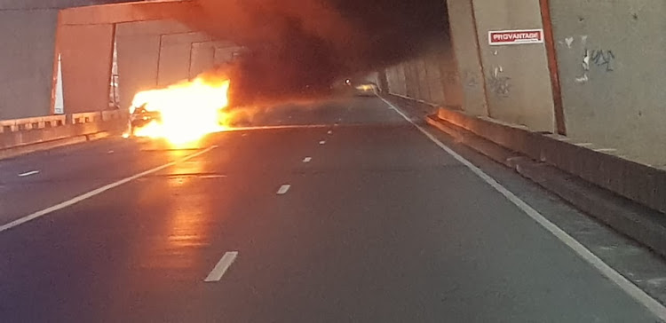 The burning car caused closure on the M1 in Johannesburg on Tuesday morning.