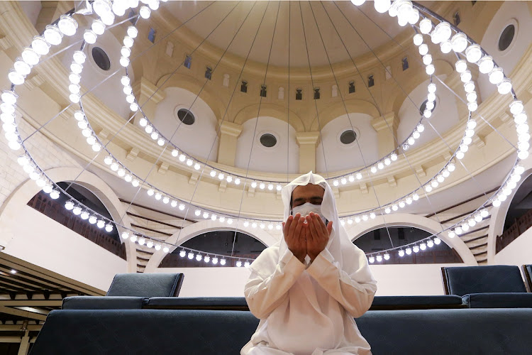 A Saudi man wearing a protective face mask performs the Al-Fajr prayer inside the Al-Rajhi Mosque, after the announcement of the easing of lockdown measures amid the coronavirus disease (COVID-19) outbreak, in Riyadh, Saudi Arabia May 31 2020.