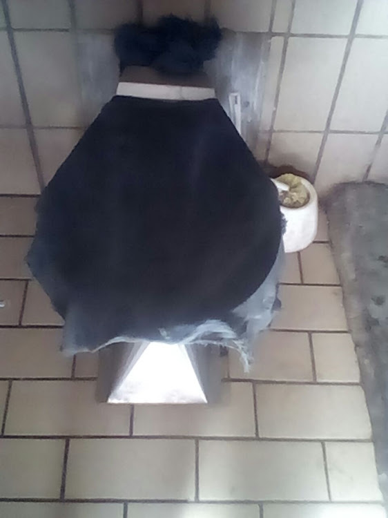 A picture sent by an inmate of Middledrift prison shows how blankets have been placed over already-full toilets to prevent them from being used.