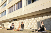 Brent Robinson (centre) of Mouille Point leads his neighbours through a yoga class.