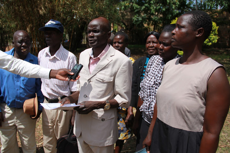 Some Homa Bay County Retirees Group members led by secretary Naphtali Okumu speak to journalists in Homa Bay town on April 21, 2022