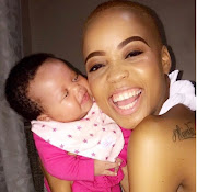 Ntando Duma and baby Sbahle share a cute moment. 