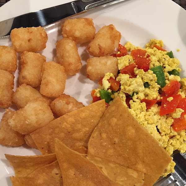 Tater tots, chips, eggs and peppers