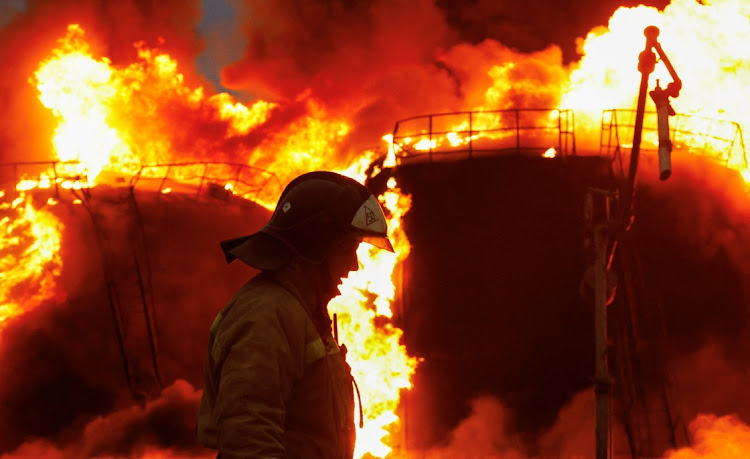 A firefighter works to extinguish fire following recent shelling at an oil storage in the course of Russia-Ukraine conflict in the town of Shakhtarsk near Donetsk, Russian-controlled Ukraine, October 27 2022. Picture: ALEXANDER ERMOCHENKO/ REUTERS