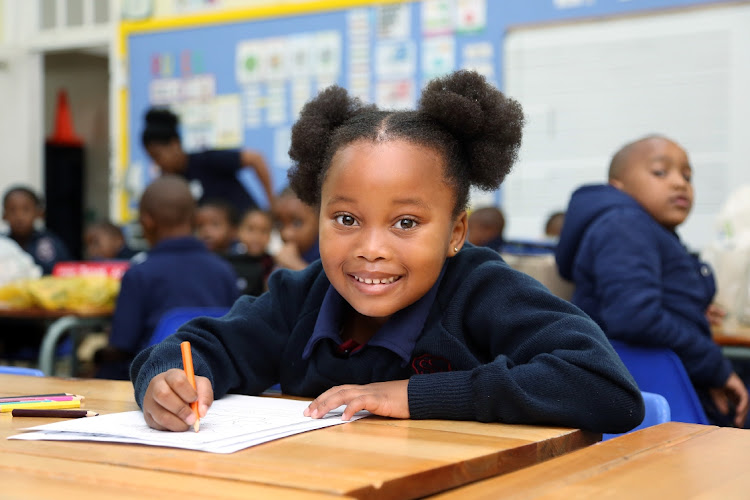 Iyazi Gxoyiya full of smiles to be starting grade 1 at Southernwood Primary School in East London.