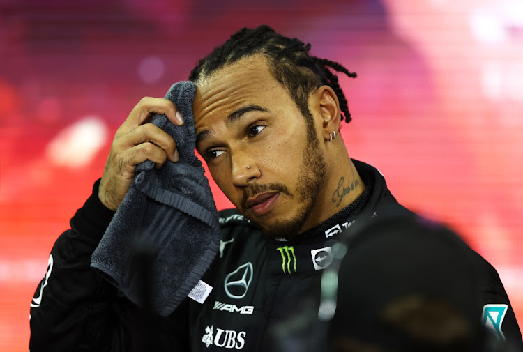 Second-placed and championship runner-up Lewis Hamilton of Great Britain and Mercedes looks dejected in parc ferme after the F1 Grand Prix of Abu Dhabi at Yas Marina Circuit on December 12, 2021