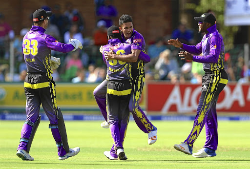 SLOW POISON Dolphins spin bowler Keshav Maharaj, centre, celebrates bowling out the Warriors' Jon-Jon Smuts on the first ball during the T20 Challenge match at St George's Park, Port Elizabeth, at the weekend