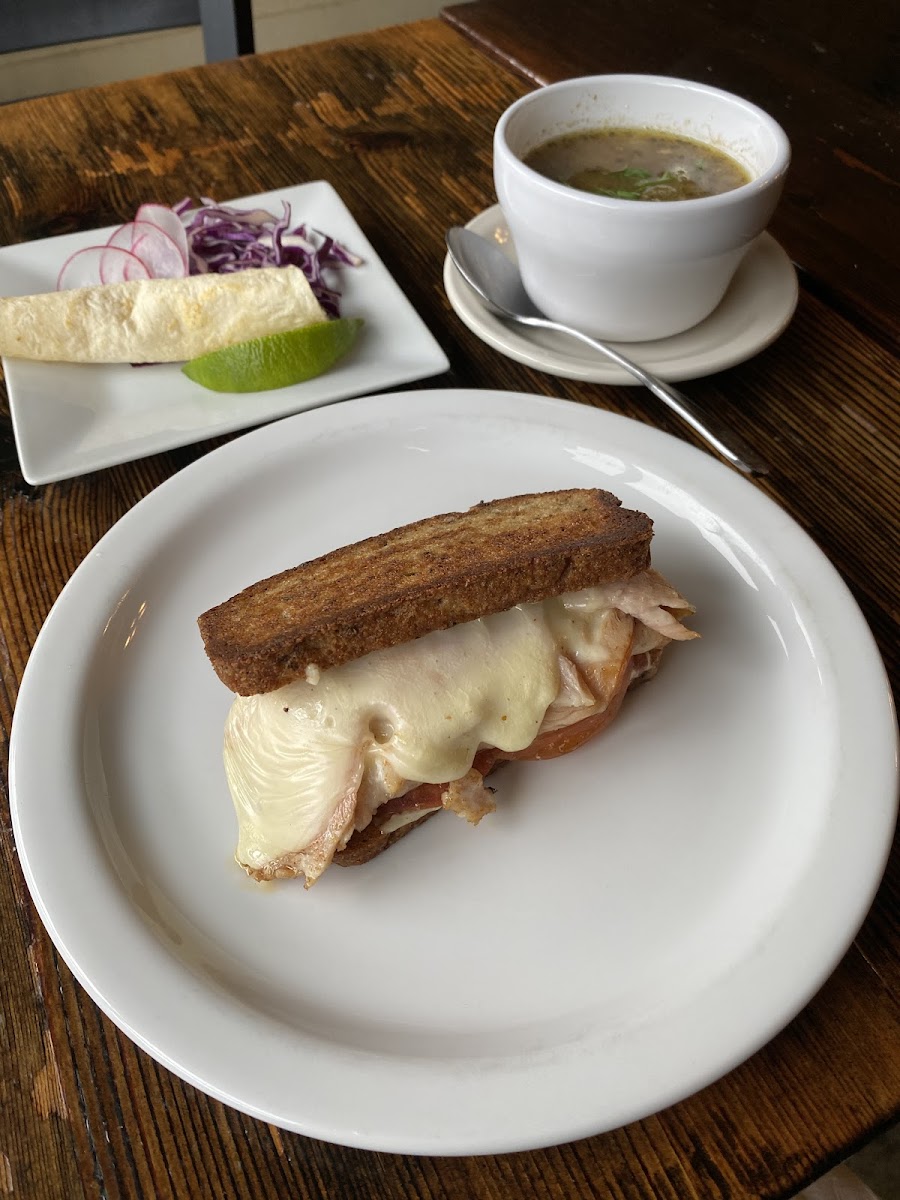 Turkey melt sandwich on delicious gluten free bread and pozole verde soup.