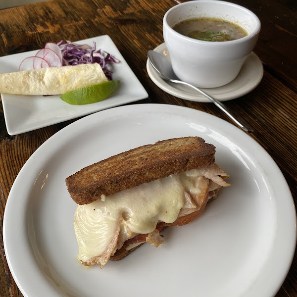 Turkey melt sandwich on delicious gluten free bread and pozole verde soup.