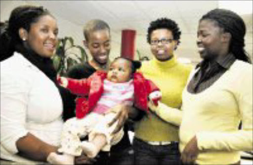 FAMILY CARE: Sowetan Staff meet Baby Owami who has been reunited with her family one month after her mother disappeared and left her in the care of her friend in Orange Farm. Pic. Vathiswa Ruselo. 17/06/08. © Sowetan.