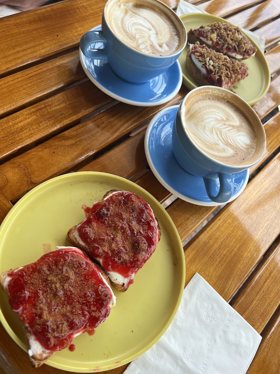 Lattes & GF toast with goat cheese & strawberry jam