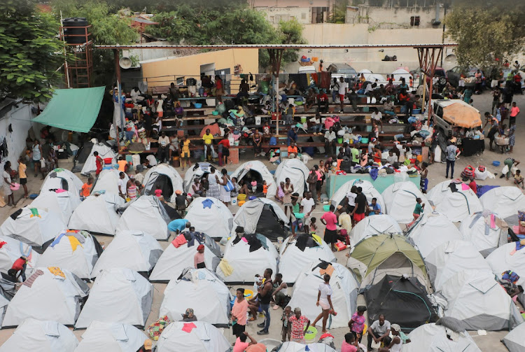 People fleeing gang violence take shelter at a sports arena, in Port-au-Prince, Haiti September 1, 2023.