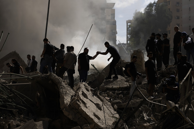 Smoke rises from a building destroyed by an Israeli airstrike in Beirut, Lebanon, October 2 2024. Picture: DANIEL CARDE/GETTY IMAGES