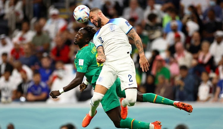 Senegal's Famara Diedhiou in action with England's Kyle Walker at the Al Bayt Stadium in Al Khor, Qatar, December 4 2022. Picture: CARL RECINE/REUTERS