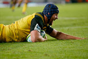 Mark Abbott of the Hurricanes scores a try during the round eight Super Rugby match between the Blues and the Highlanders at Eden Park on April 15, 2017 in Auckland, New Zealand.