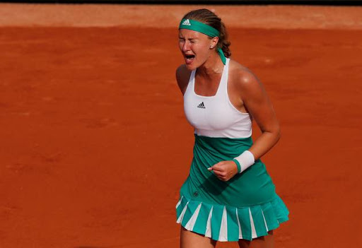 France's Kristina Mladenovic celebrates during her first round match against USA's Jennifer Brady.