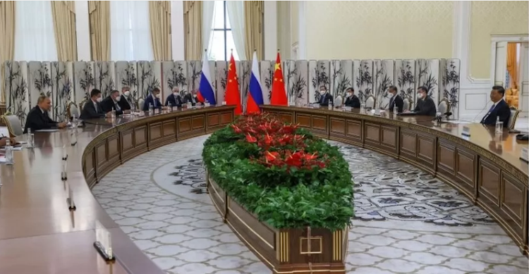 Mr Putin (far left) and Mr Xi (far right) met at the Shanghai Cooperation Organization summit in Samarkand