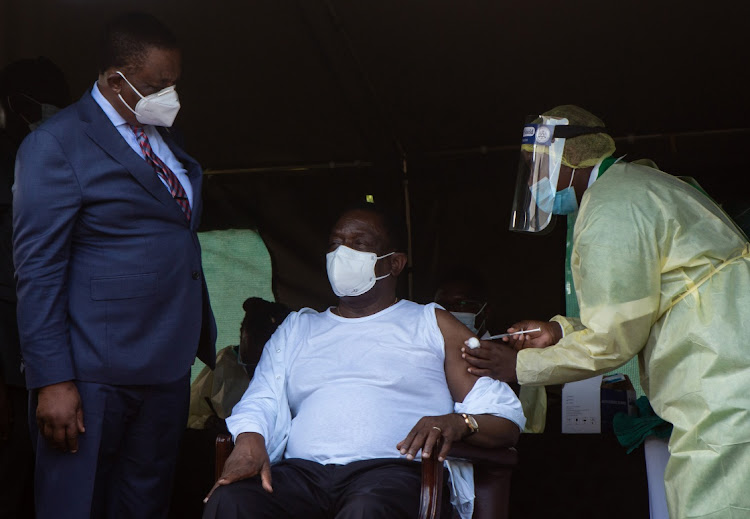 Zimbabwe President Emmerson Mnangagwa's vaccination at a public event was meant to assure citizens that the vaccines were safe.