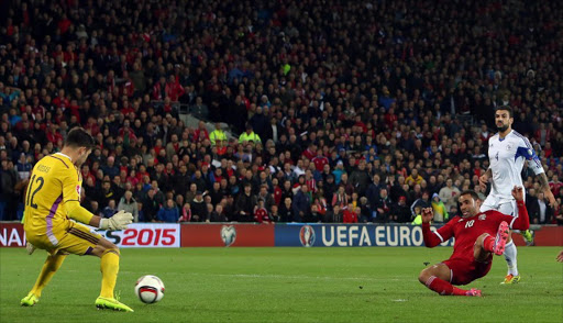 Wales' Hal Robson-Kanu (2nd R) scores his team's second goal during a UEFA 2016 European Championship qualifying group B football match between Wales and Cyprus in Cardiff, Wales, on October 13, 2014.