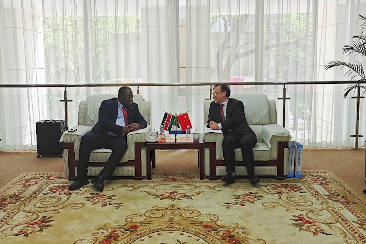 NuPEA CEO Justus Wabuyabo (left) with China's National Nuclear Corporation Overseas Ltd president Wang Yongge during a meeting in Beijing, China.