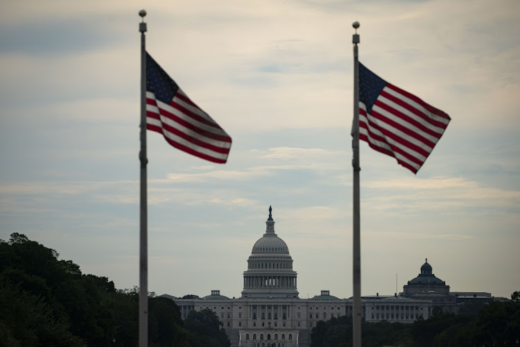 American flags fly near the US Capitol in Washington, DC, US. File photo: BLOOMBERG/AL DRAGO