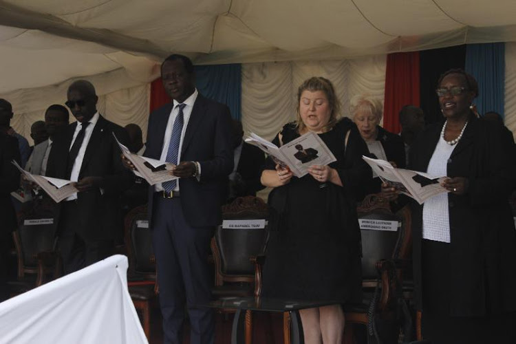 Starehe Boys Centre Director Josephat Mwaura, Jubilee Party Sec. Gen Raphael Tuju, the late Ken Okoth's wife Monica Okoth during the funeral service of the late MP>