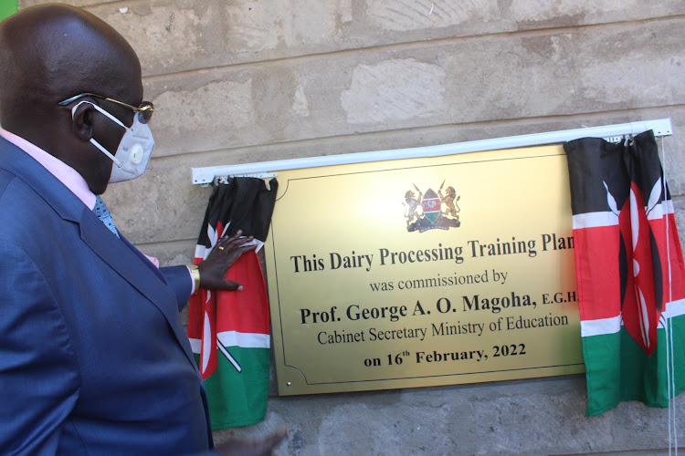 Education CS George Magoha unveils a plaque when he commissioned a milk plant at the Nyeri national polytechnic on Wednesday, February 16.