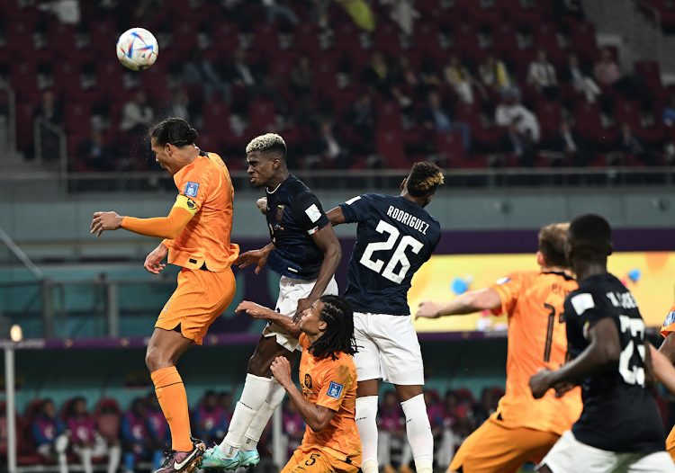 Virgil van Dijk (L) of the Netherlands in action against Ecuador during a Fifa World Cup match at Khalifa International Stadium in Doha, Qatar November 25