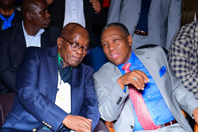 Former president Jacob Zuma and Rivers of Living Waters Ministries Bishop Bafana Stephen Zondo chat during Zuma's visit to the church.