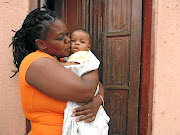 Relieved  mother Dipuo Nyambiri kisses  her baby boy yesterday  after she was reunited with the three-month-old  who was stolen  on Friday. /Dimakatso Modipa