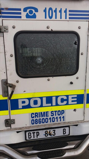 Bullet holes seen at the back of the police van involved in a shootout in Ogies.