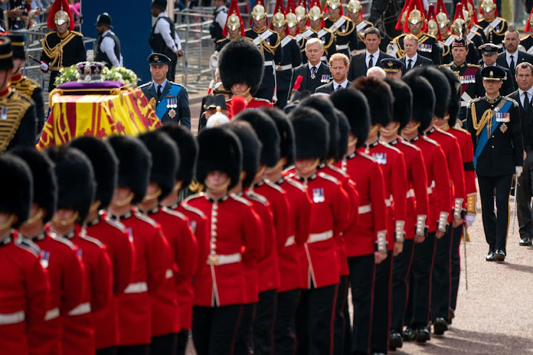 Prince William, Prince of Wales (centre left) and Prince Harry follow the coffin of Queen Elizabeth during the ceremonial procession from Buckingham Palace to Westminster Hall in London, the UK, September 14 2022. Picture: AARON CHOWN/WPA/GETTY IMAGES