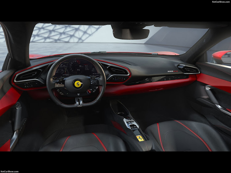 The snug cabin follows Ferrari's minimalist design approach and can be optioned with head-up display. Picture: SUPPLIED.