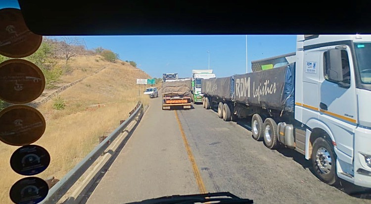 Truckers wait in long queues to cross into Zimbabwe at Beitbridge border post since the lockdown started.