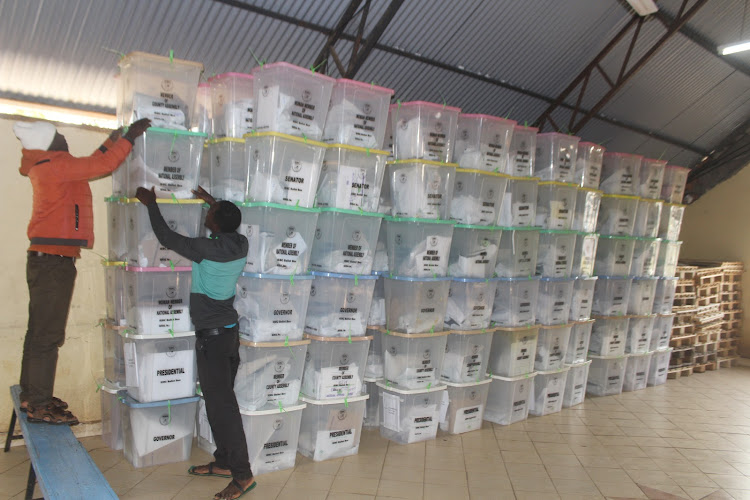 IEBC staff arrange ballot boxes at Nyambaria Boys High School in Manga subcounty, Kitutu Masaba constituency of Nyamira county on Wednesday, August 10, 2022