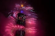 Fireworks light up the Taiwan skyline and Taipei 101 during New Year's Eve celebrations on January 1 2022 in Taipei, Taiwan.