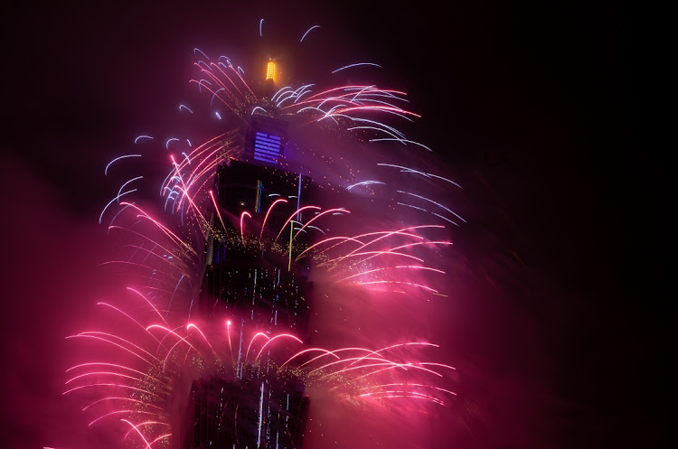 Fireworks light up the Taiwan skyline and Taipei 101 during New Year's Eve celebrations on January 1 2022 in Taipei, Taiwan.