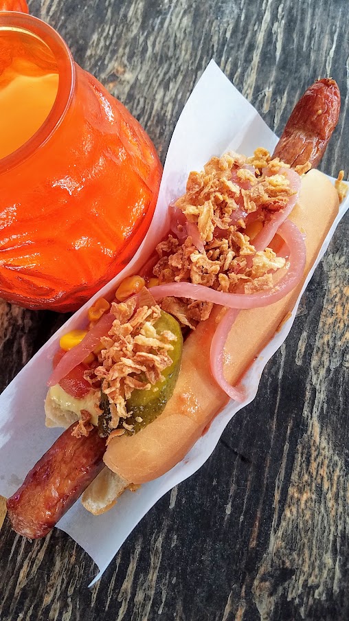 The food market of Reffen, a Danish hot dog made with organic sausage and in my case also had cheese inside, topped with crunchy fried onions, raw onions, pickles, and dressed with mustard, ketchup and remoulade..